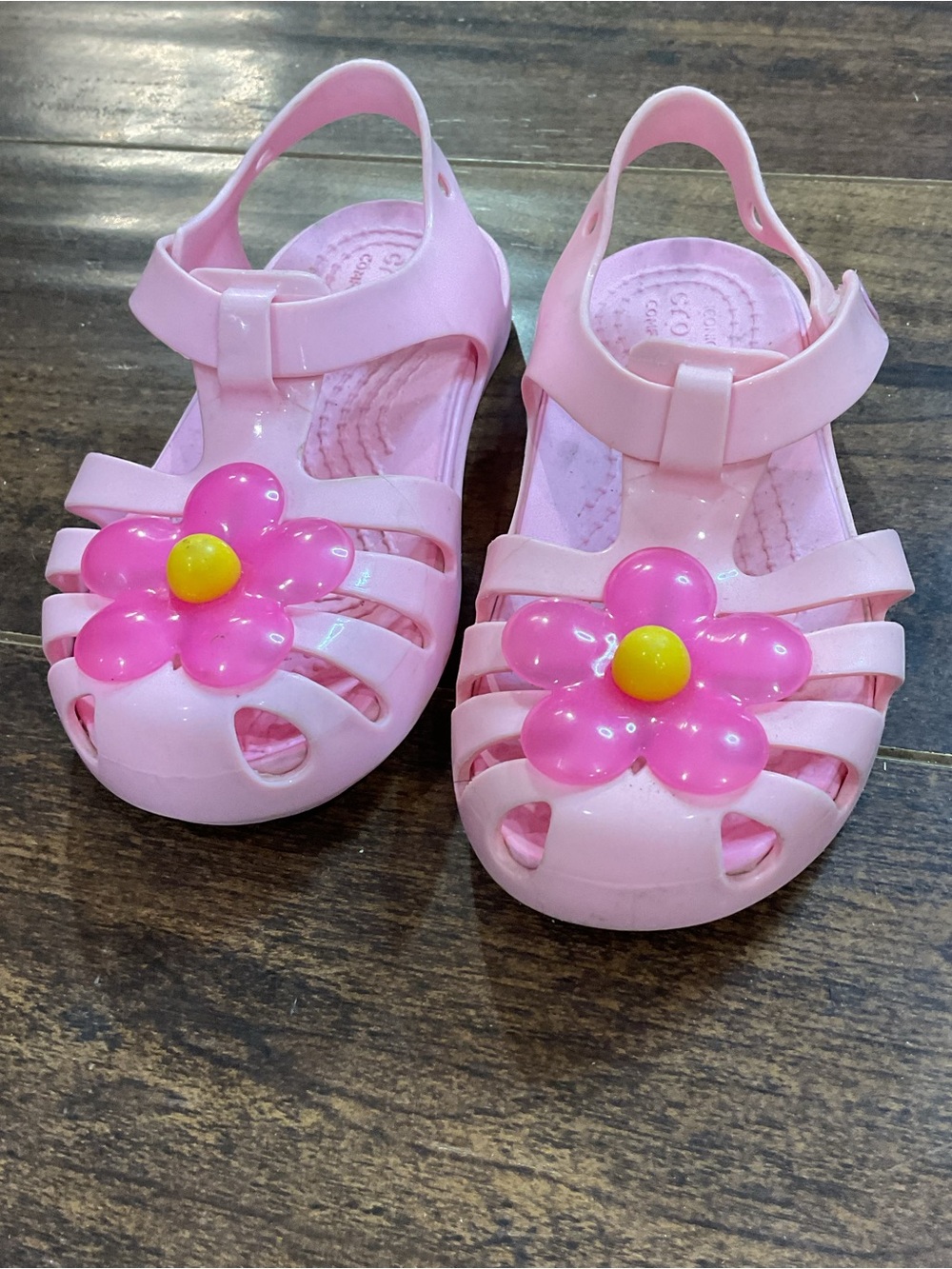 CROCS Pink Jelly Sandals with Pink Flower and Yellow Center